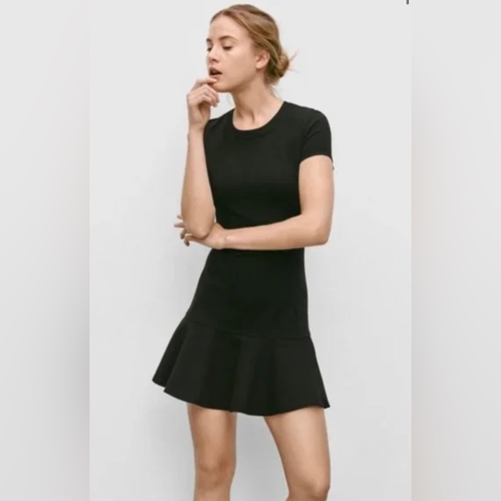 NEW WITH TAGS never been worn. Sunday Best sold by Aritzia black mini dress